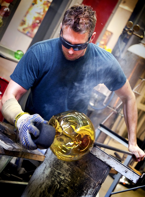 Brad in the hot bshop working on glass sculpture