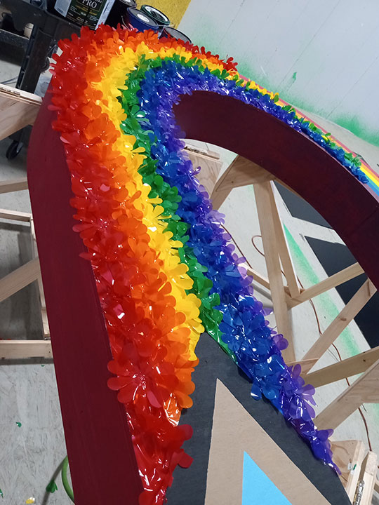 rainbow made from plastic flowers