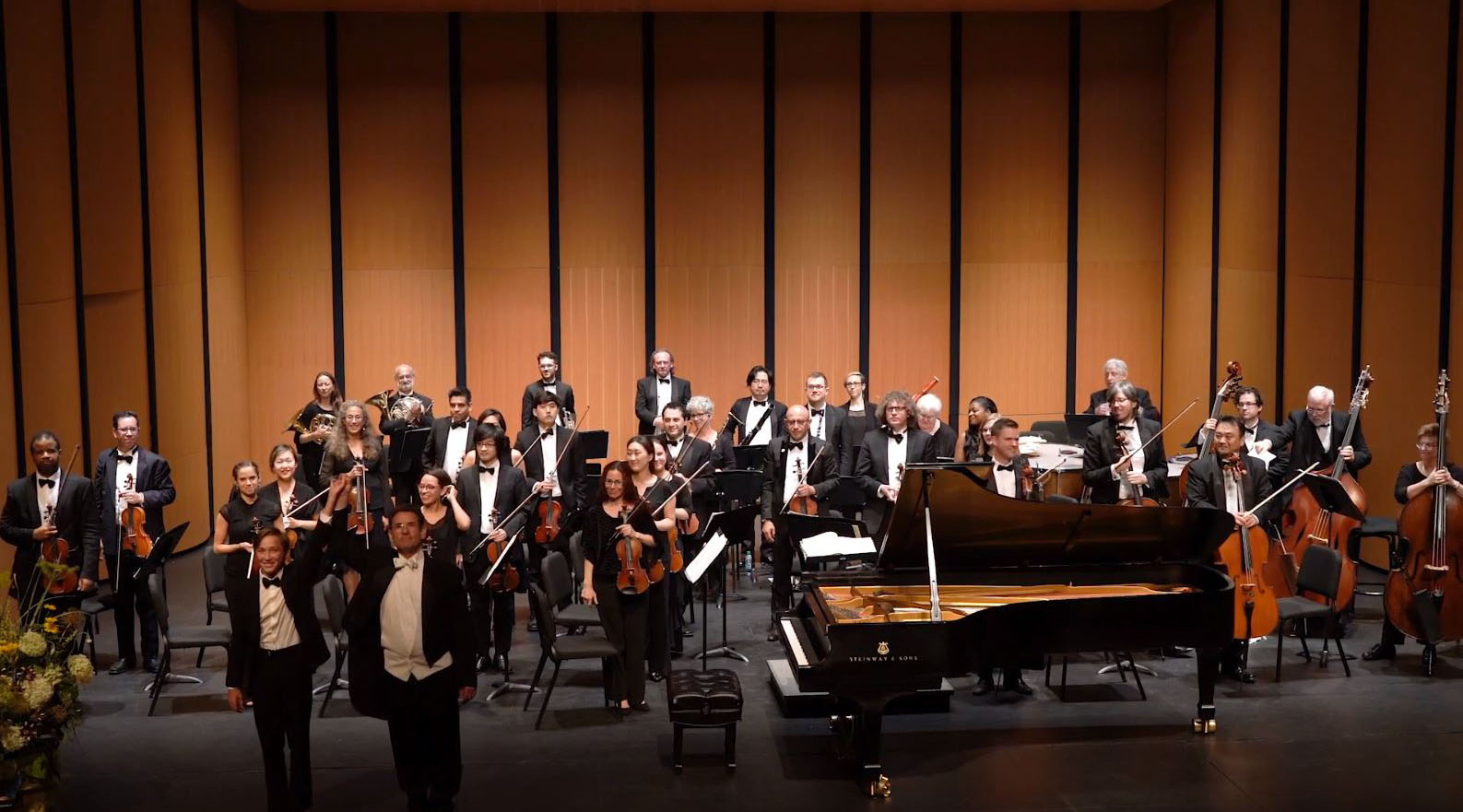 A pianist and soloist at a piano