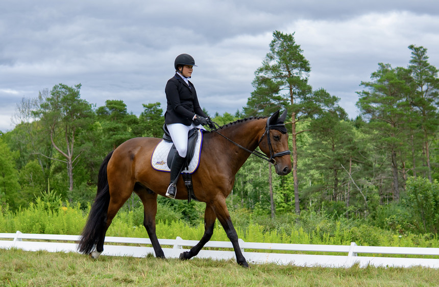 A student riding a horse