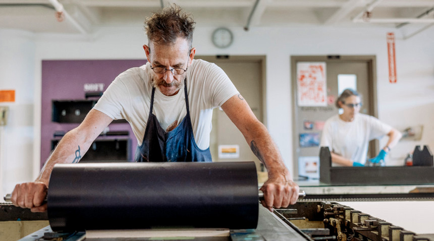 A photo of a professor printmaking