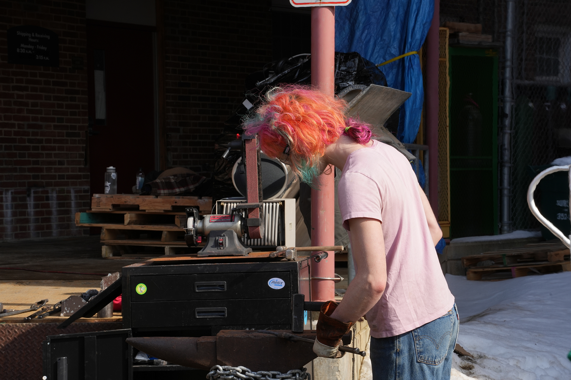A student working on equipment in the Foundry