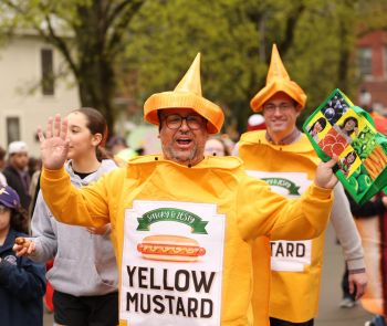 A man in a mustard costume during Hot Dog Day