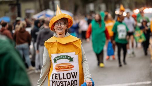 A woman in a mustard costume during Hot Dog Day