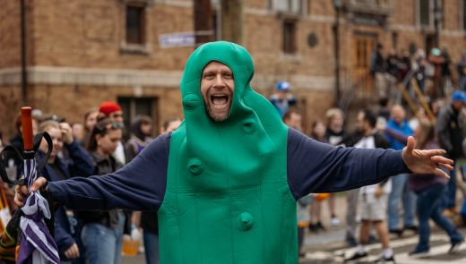 A man in a pickle costume during Hot Dog Day