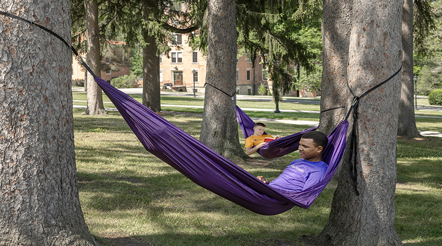 A photo of a student lying in a hammock