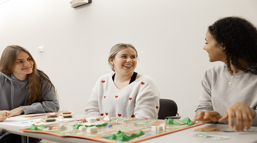 Students playing a board game