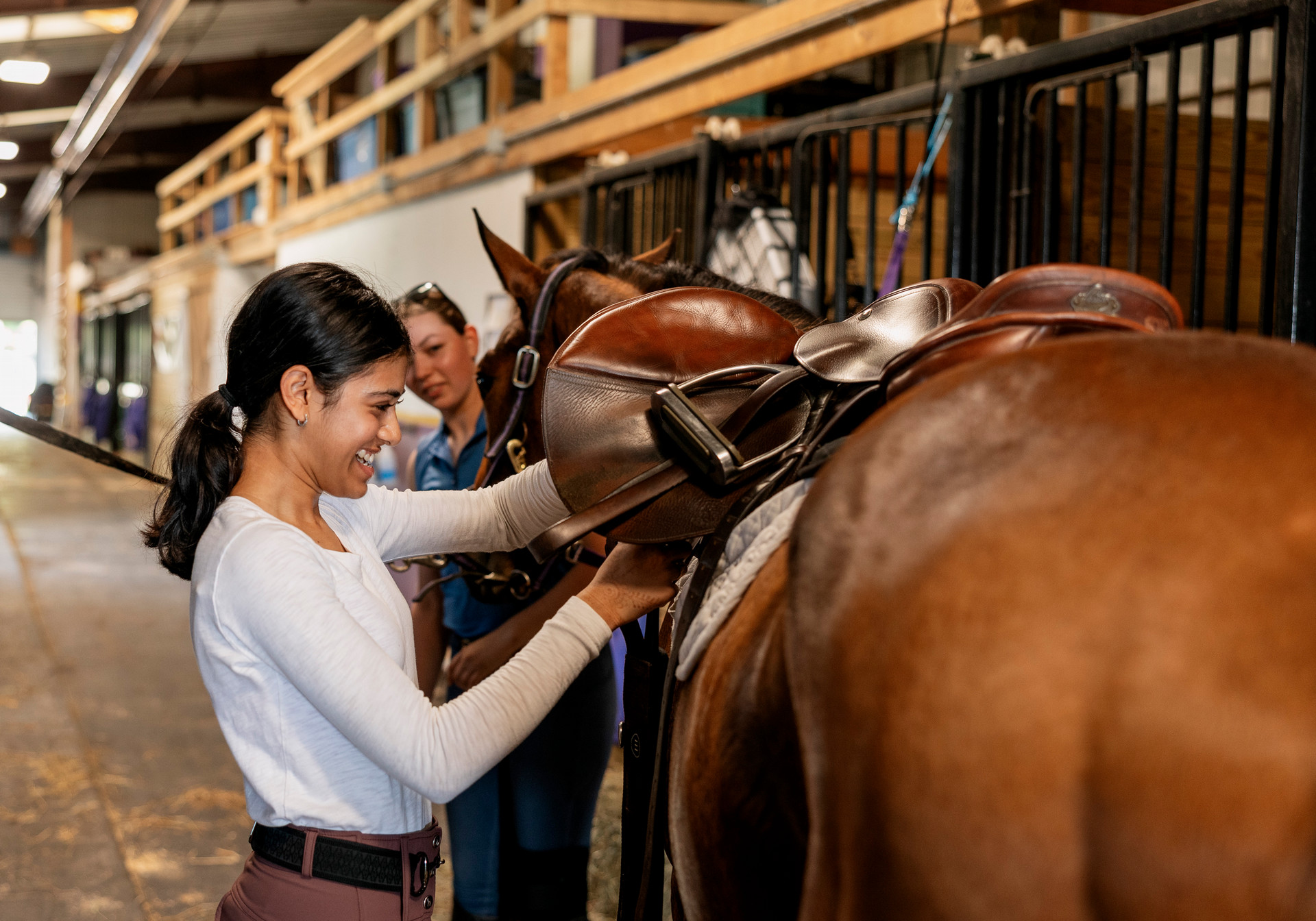 A student petting a horse