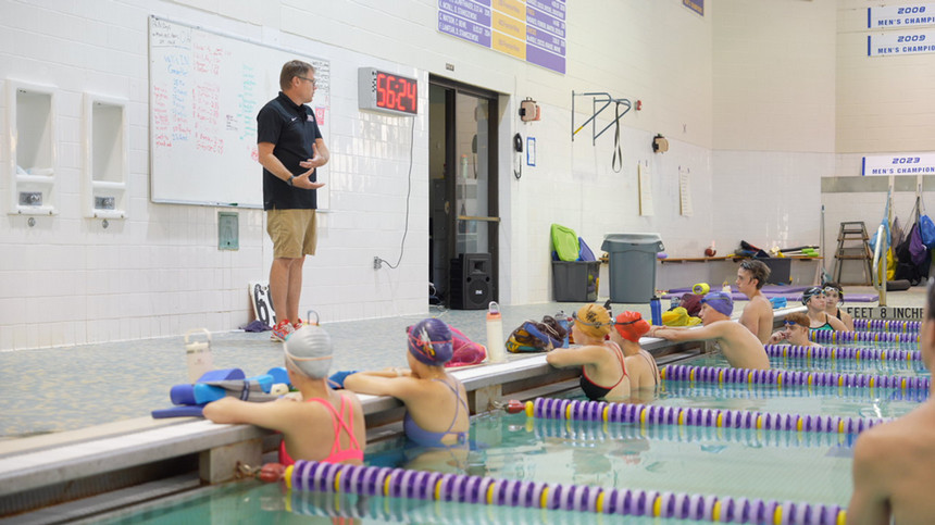 A photo of students swimming in a pool