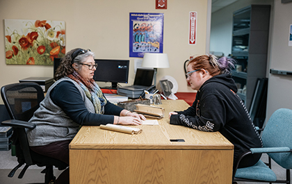Two people working together at a desk
