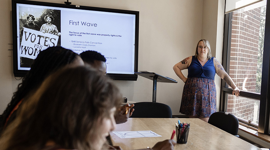 A photo of a staff member teaching a summer program