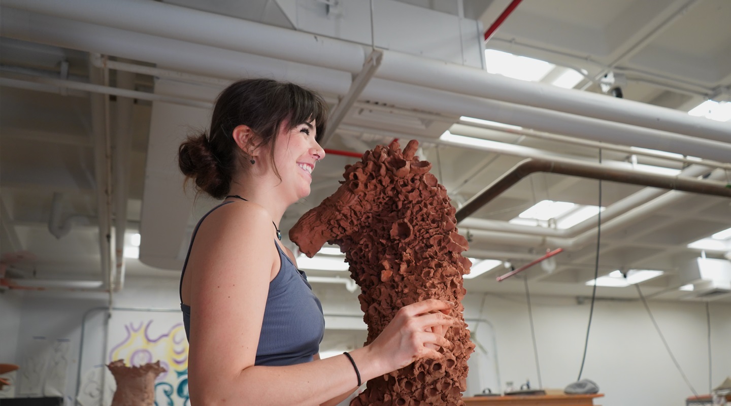 Girl molding ceramic clay