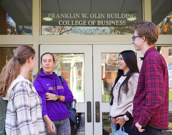 students outside of the Olin building