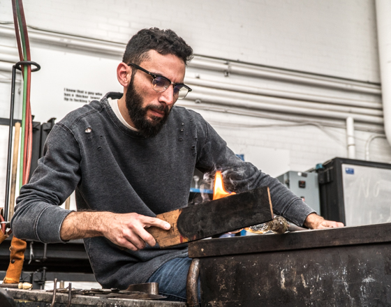 male student making a woodworking project