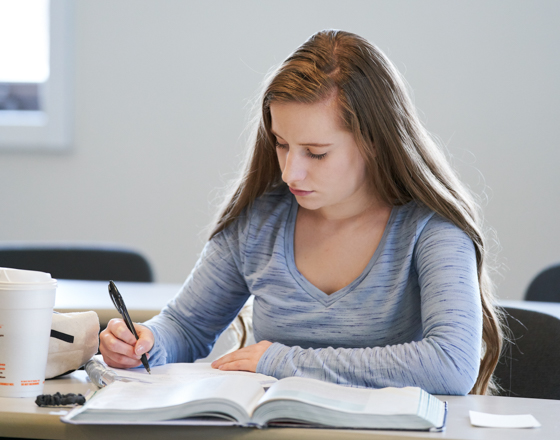 Female student taking notes
