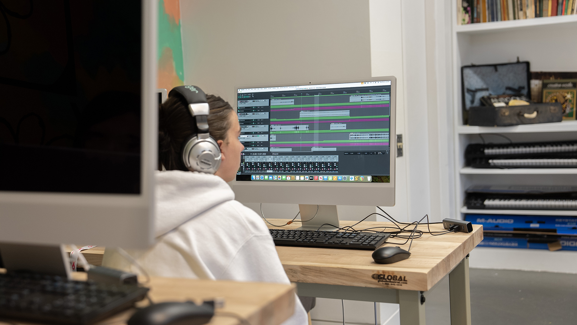 A student studying an audio platform on a computer