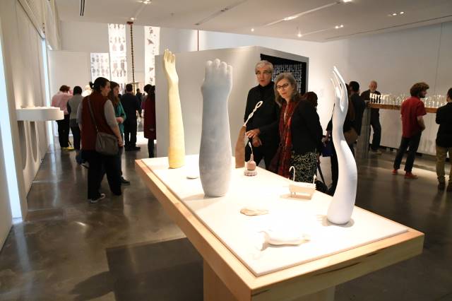 People viewing are on display at a student show