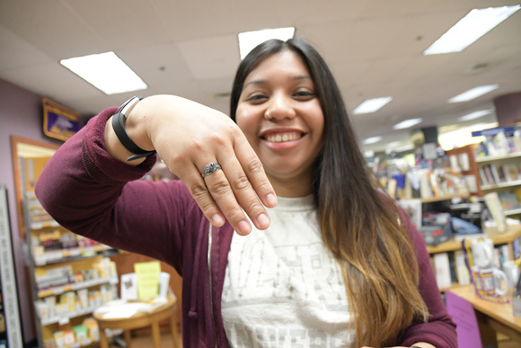 A student with a class ring on their finger