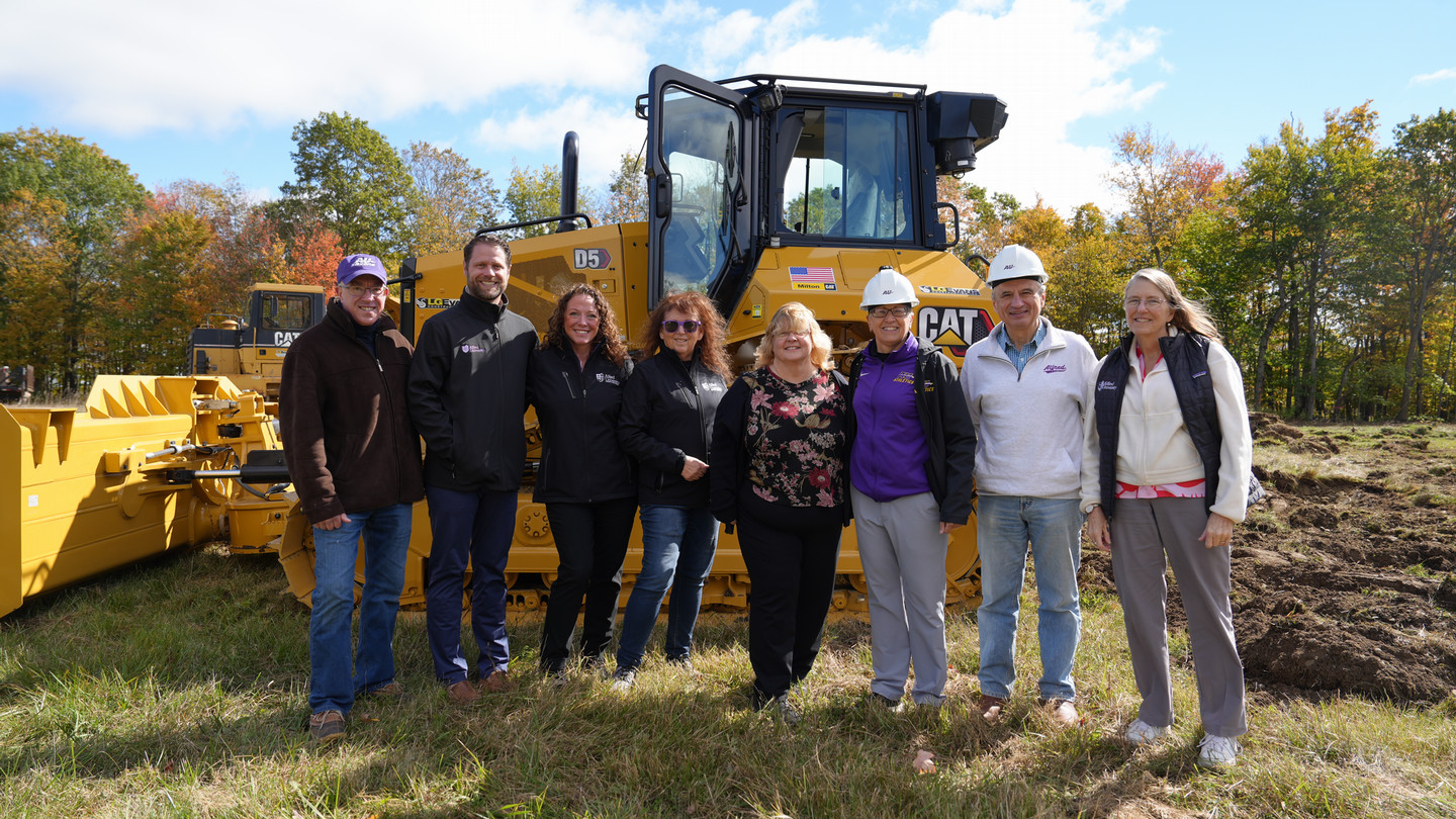 Groundbreaking crew standing on construction site
