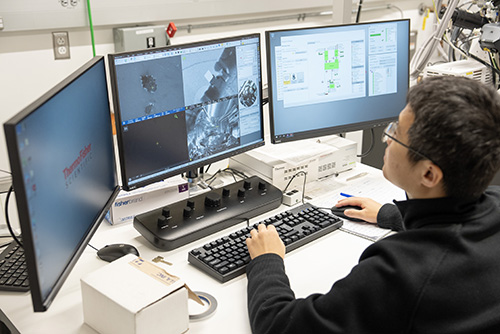 Student performing ceramics analysis testing