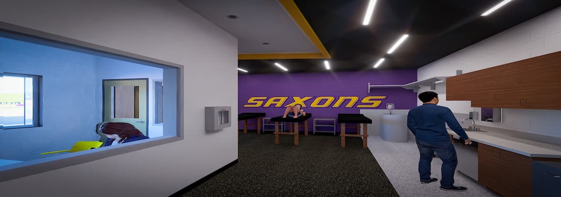 A modern interior room divided into two areas by a large window. The left area, visible through the window, features blue lighting and shows someone bending over a yellow table or bed near an exterior window. The main area on the right has black flooring, white walls with wooden cabinets, and recessed lighting with yellow accents on the ceiling. A person in blue clothing stands at a counter with a sink on the right side of this area. In the background are three treatment tables against a purple wall displaying "SAXONS" in large yellow letters.