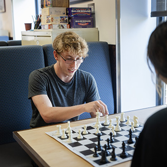 A photo of a student playing chess