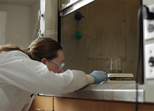 A photo of an Alfred University student working in an engineering lab