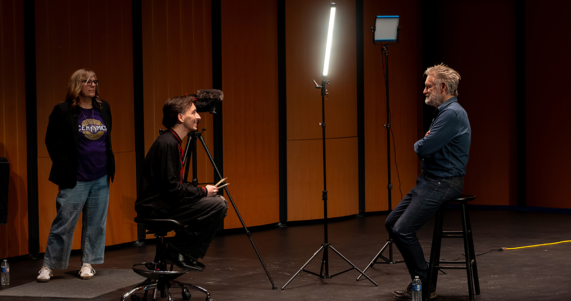 A photo of an Alfred University student conducting an interview