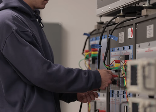 A photo of an Alfred University engineering student working in an engineering lab