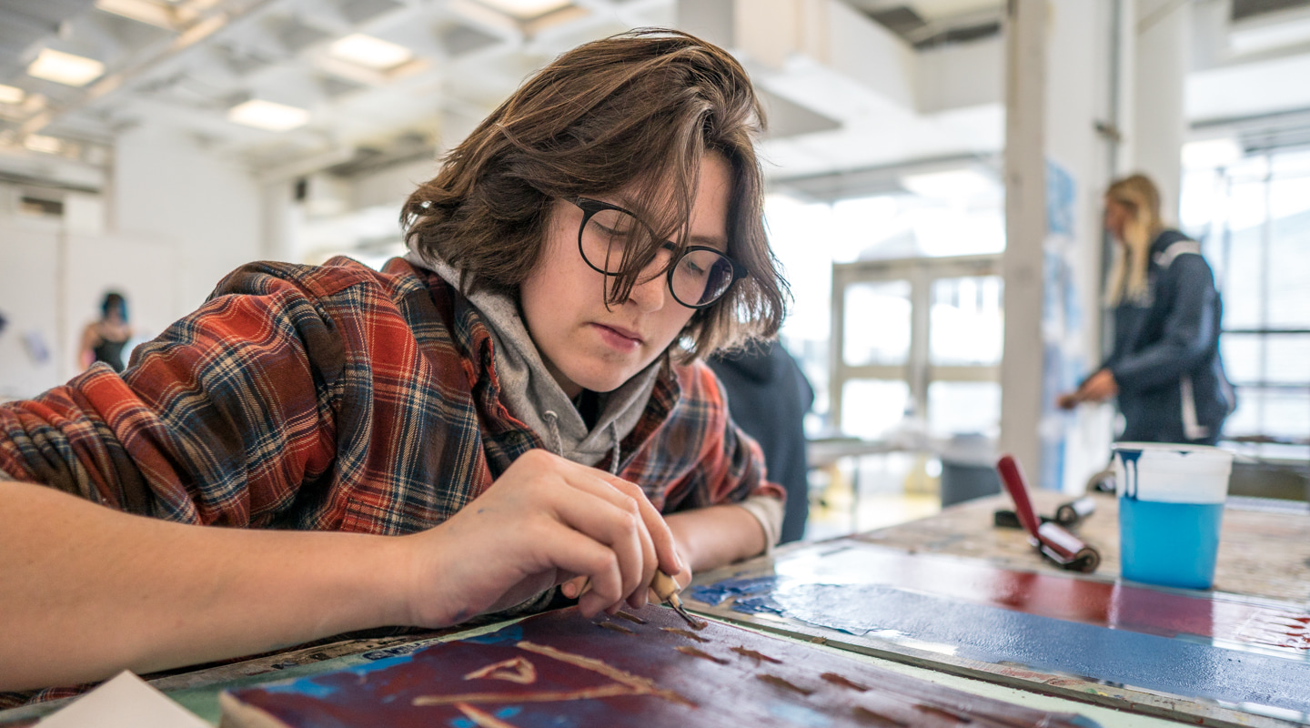 student creating artwork