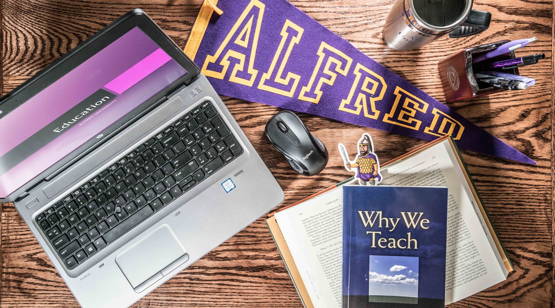 laptop with items around on desk