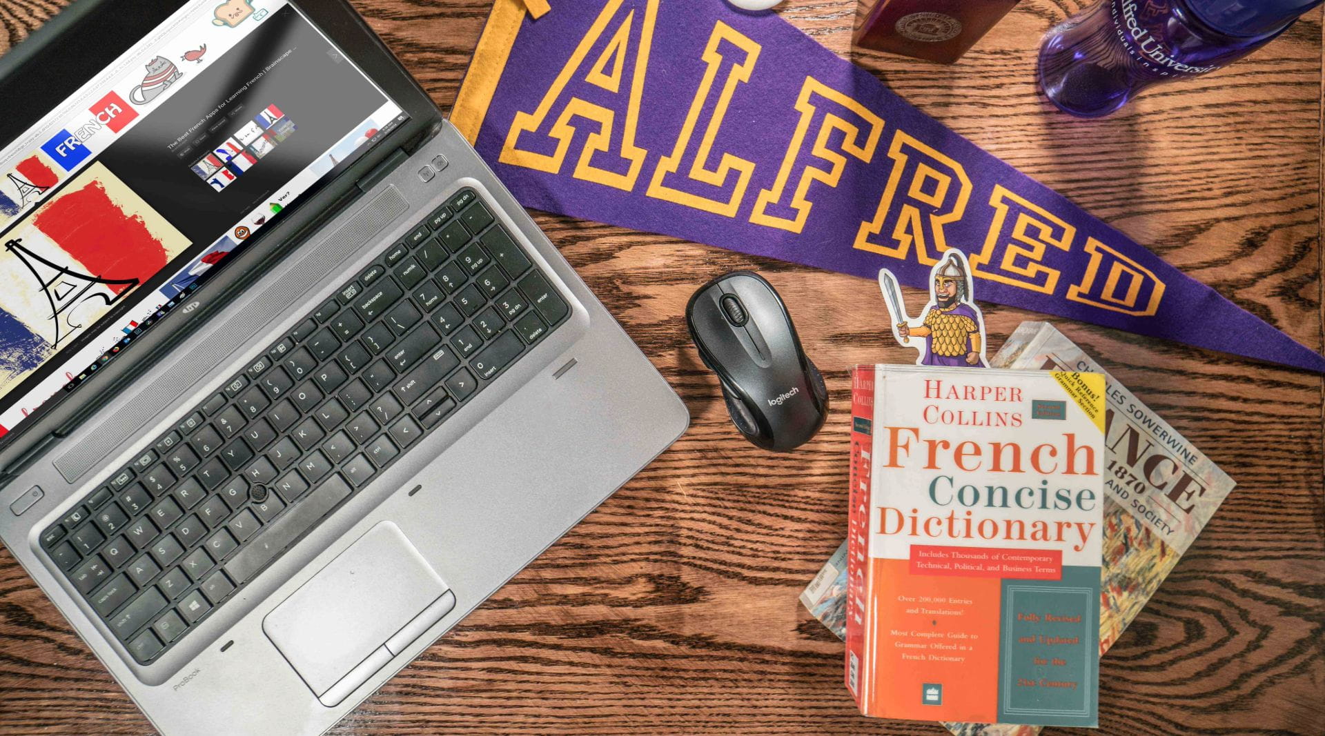 laptop with items on desk