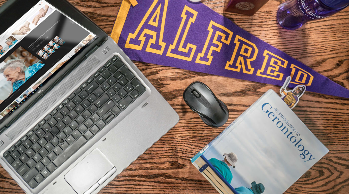 laptop with items on desk