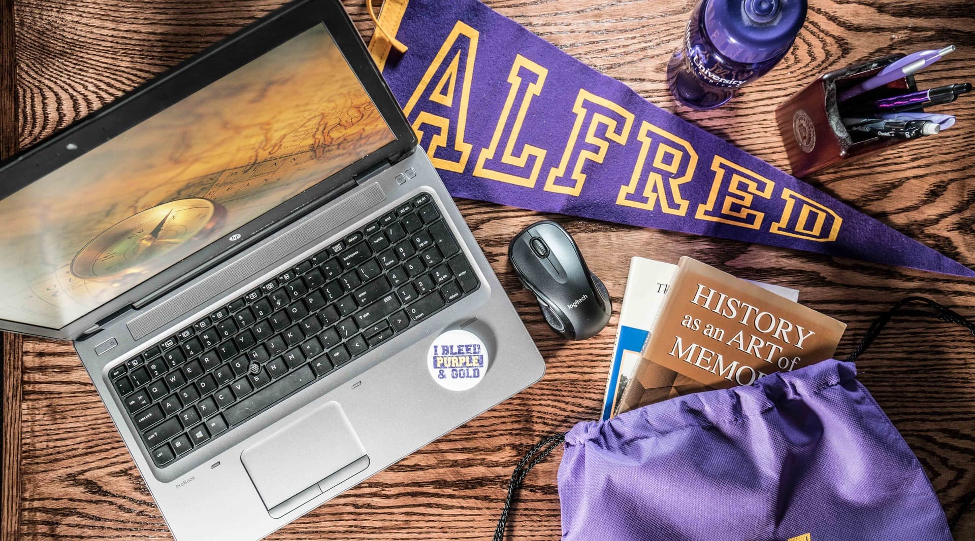 laptop with items on desk
