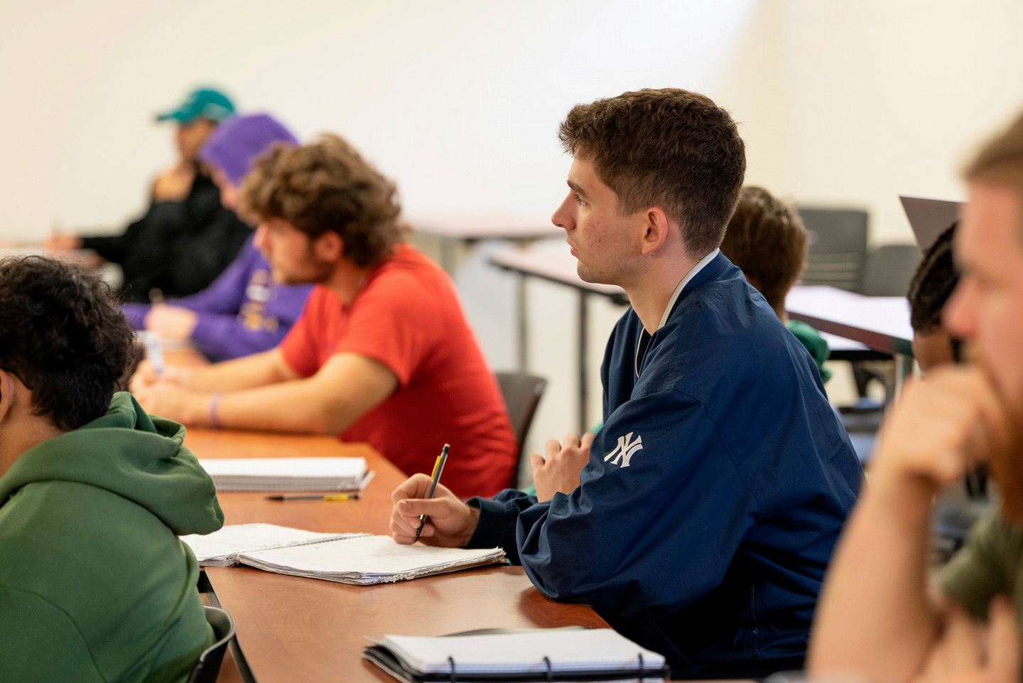 students listening to professor in class