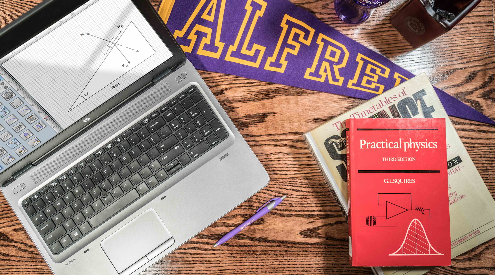 laptop with items on desk