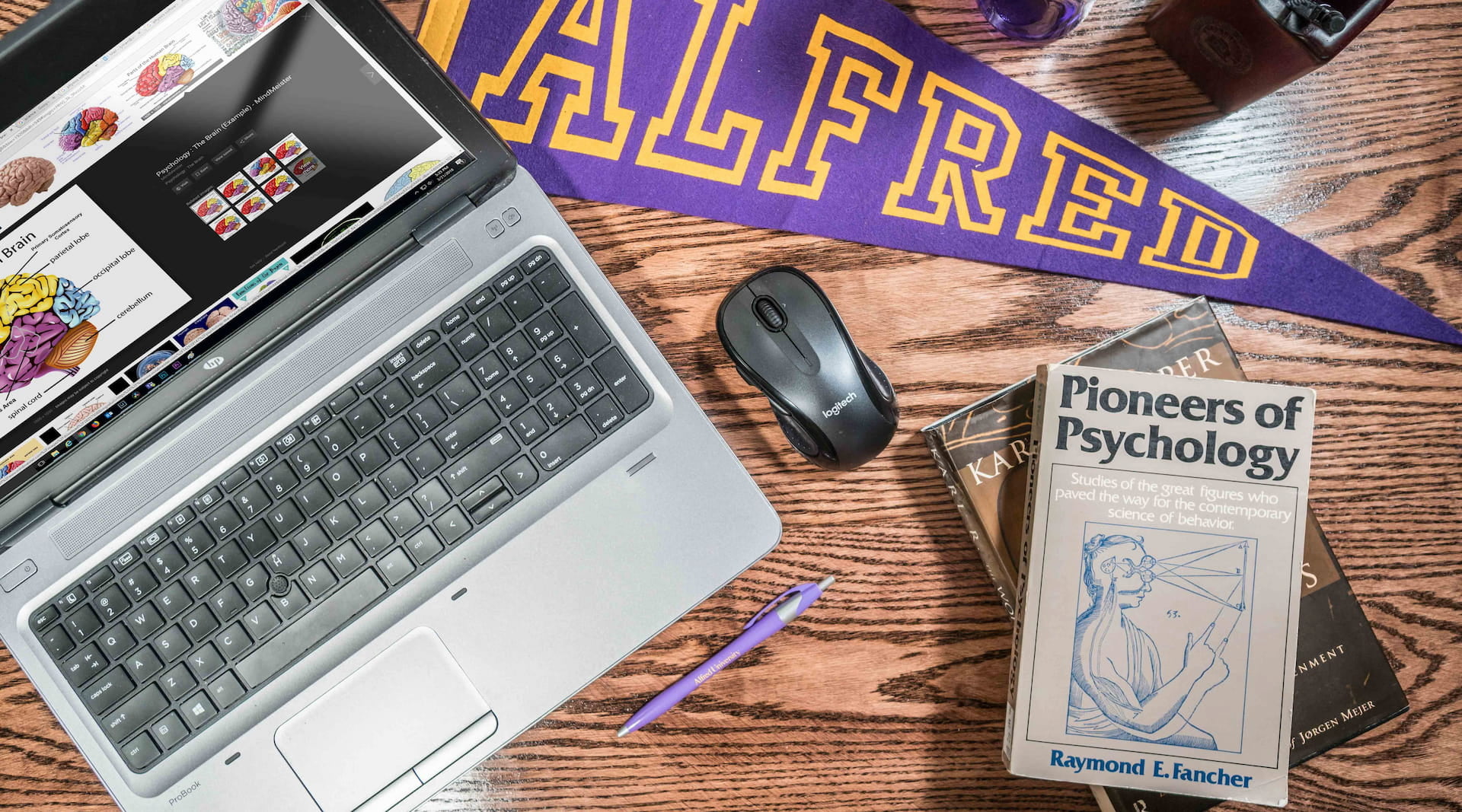 laptop with items on desk