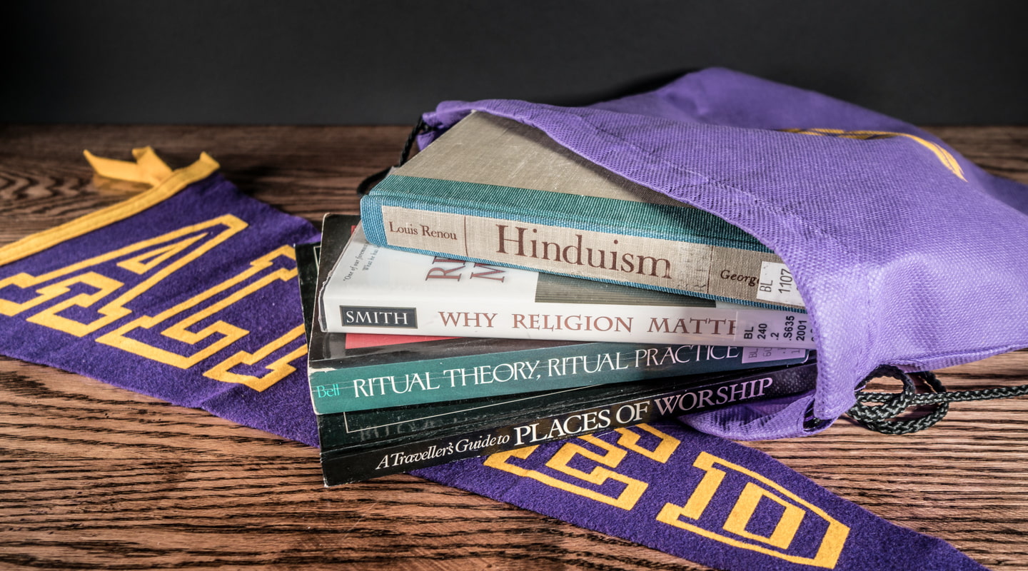 books about religion on a desk