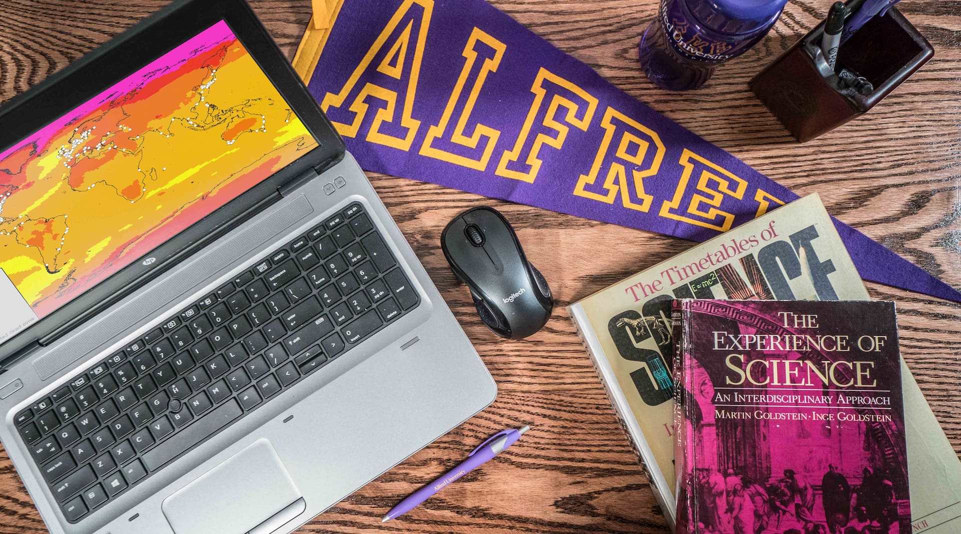 laptop with items around it on desk