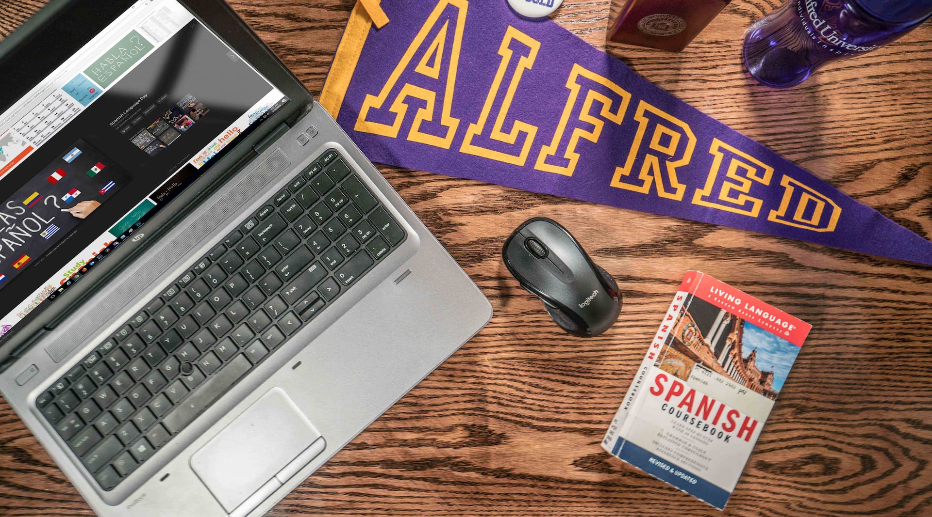 laptop with items on desk