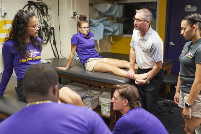 checking athlete's ankle