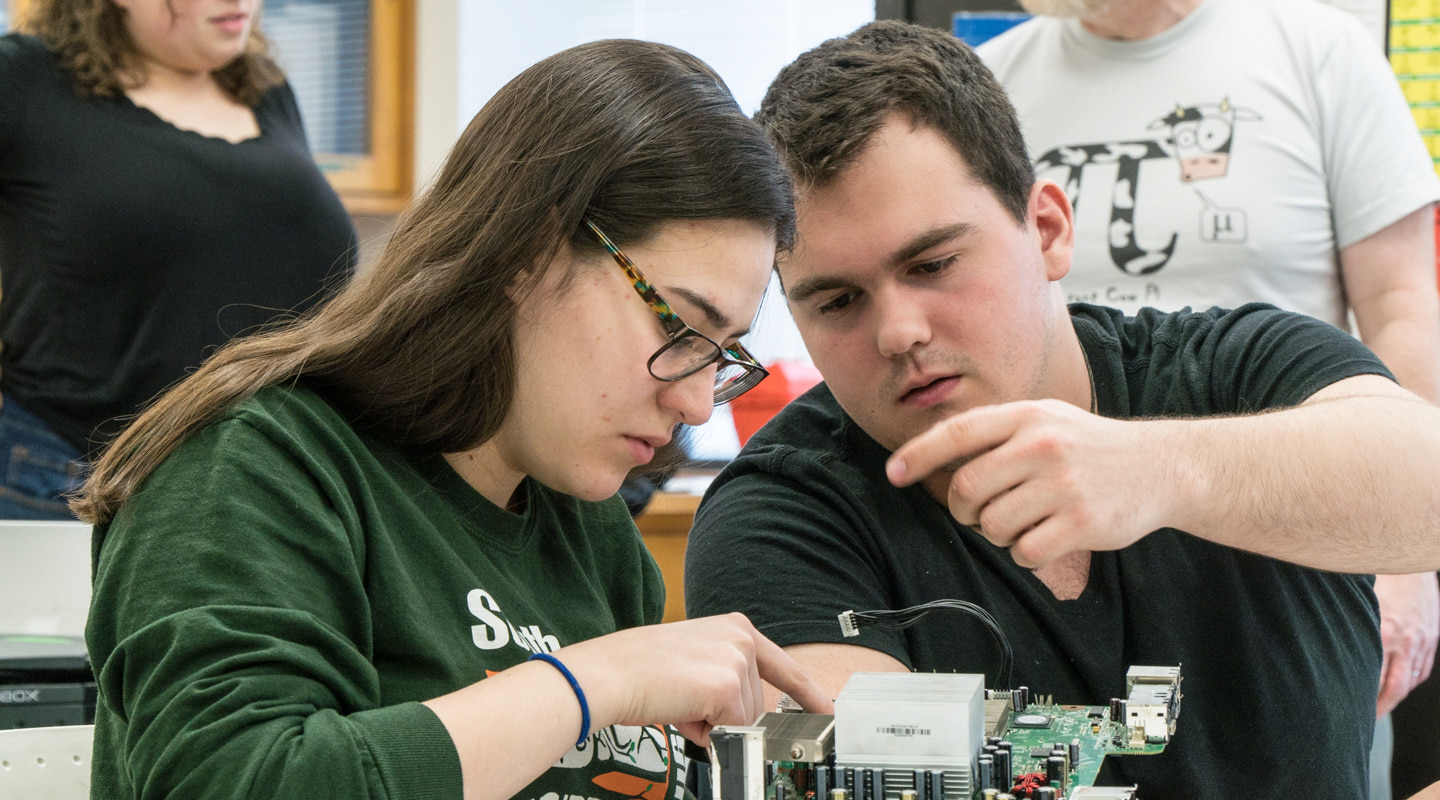 students working on electrical part