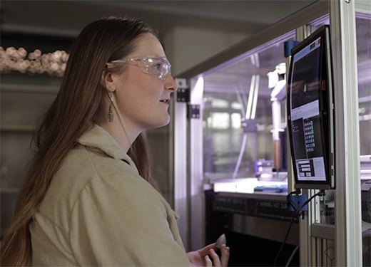 A photo of an Alfred University engineering student working in an engineering lab