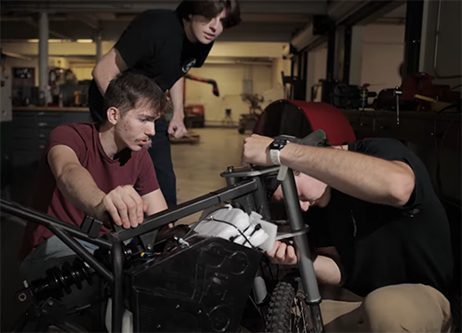 A photo of three Alfred University engineering students working in an engineering lab