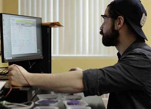 A photo of an Alfred University engineering student using a computer
