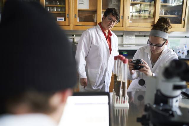 student and professor in biology lab