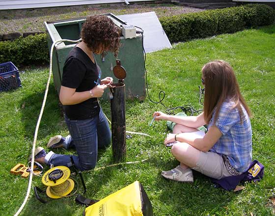 Two students doing Field Sampling Analysis