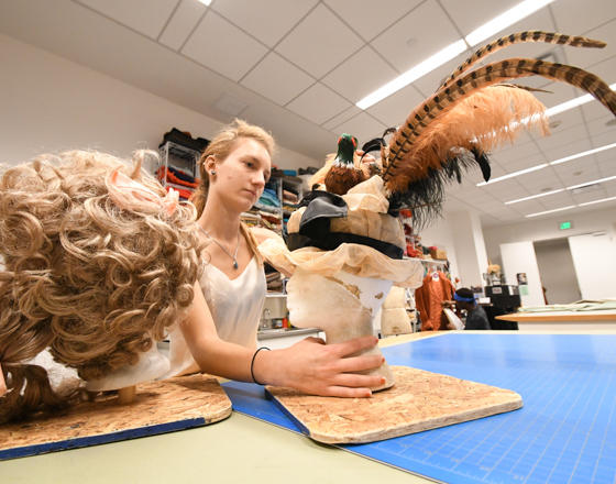 student preparing costume