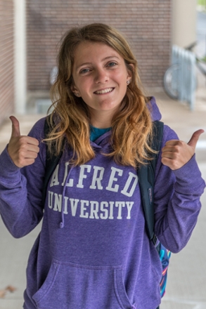 Female student in purple Alfred University sweatshirt
