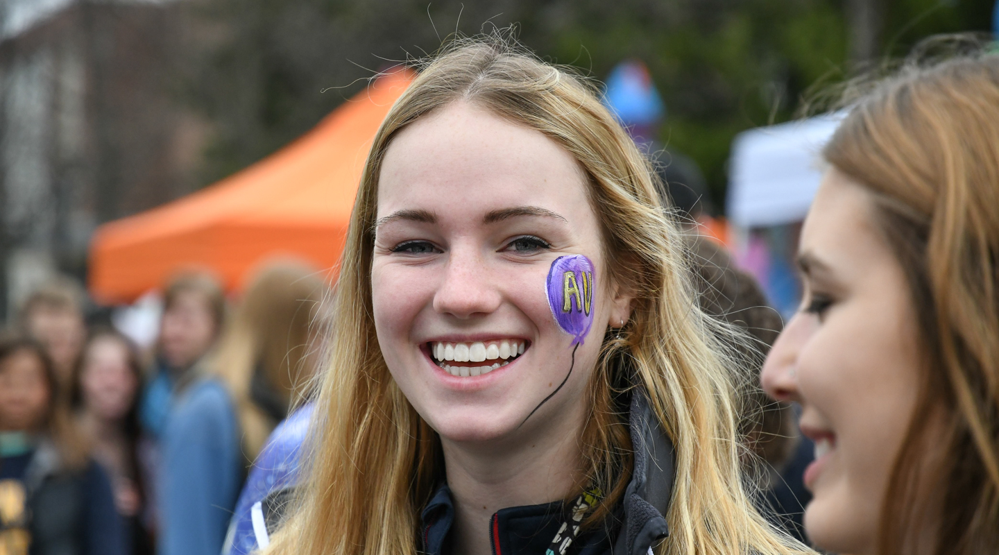 Student with face paint at campus event